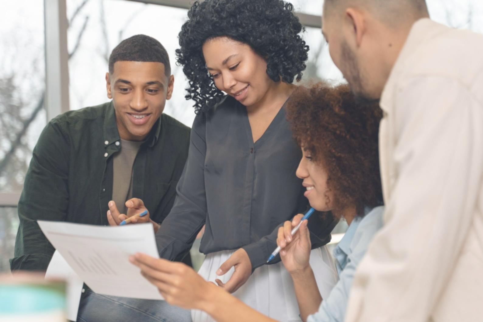 Business owner reviewing financial documents with practical application focus